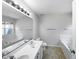 Double vanity bathroom with a shower and garden tub at 5107 Sandy Banks Rd, Raleigh, NC 27616