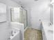 Bathroom features a shower and tub combo, and double vanity at 5107 Sandy Banks Rd, Raleigh, NC 27616