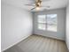 Well-lit bedroom with ceiling fan and carpet flooring at 5107 Sandy Banks Rd, Raleigh, NC 27616