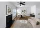 Virtually staged living room features a fireplace and a dining area at 5107 Sandy Banks Rd, Raleigh, NC 27616