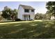 White two-story house with backyard and green grass at 44 Wallace St, Angier, NC 27501