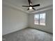 Bright bedroom with ceiling fan and neutral carpeting at 141 Greenview St, Clayton, NC 27520