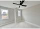 Bedroom with ceiling fan and two windows at 100 Firefly Ln, Louisburg, NC 27549