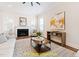 Living area with fireplace and large windows at 100 Firefly Ln, Louisburg, NC 27549