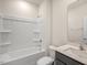 Clean bathroom with a shower/tub combo and built-in shelving at 35 Finsbury Ct, Lillington, NC 27546