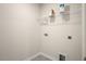 Functional laundry room with shelving and hookups at 35 Finsbury Ct, Lillington, NC 27546