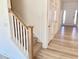 Modern staircase with light wood railing and carpet at 281 Creekhaven Dr # 154, Angier, NC 27501