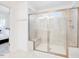 Large walk-in shower with built-in bench in main bathroom at 310 Narbeth Ct, Sanford, NC 27330