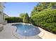 Inviting kidney shaped pool with water features at 122 Highclere Ln, Cary, NC 27518