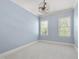 Light and airy bedroom with neutral walls and carpet flooring at 122 Highclere Ln, Cary, NC 27518