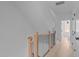 Bright hallway with light wood floors and modern railing at 3005 Corbell Rd, Durham, NC 27701
