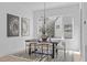 Elegant dining room features a dark wood table and modern chandelier at 3005 Corbell Rd, Durham, NC 27701