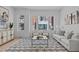 Bright living room features stylish furnishings and large windows at 3005 Corbell Rd, Durham, NC 27701