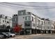 Modern townhouses with sleek gray siding and rooftop decks at 3005 Corbell Rd, Durham, NC 27701