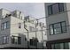 Modern townhome building with gray siding and large windows at 3005 Corbell Rd, Durham, NC 27701