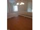 Bright dining room with hardwood floors and a chandelier at 8108 N Creek Run, Raleigh, NC 27613