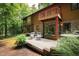Back exterior showcasing deck and wooded area at 4416 Arrowhead Trl, Hillsborough, NC 27278