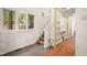 Modern staircase with gray tile and built-in shelving unit at 4416 Arrowhead Trl, Hillsborough, NC 27278
