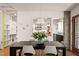 Modern dining area features a sleek table and chairs, open to the kitchen at 4416 Arrowhead Trl, Hillsborough, NC 27278