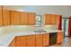 Kitchen with light wood cabinets and double sink at 185 Weatherbend, Pittsboro, NC 27312