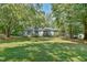 Single-story house with a large front yard at 185 Weatherbend, Pittsboro, NC 27312