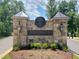 Stone entrance to Norwood Ridge community with a logo and lighting at 5828 Norwood Ridge Dr, Raleigh, NC 27614