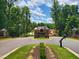 Entrance to Norwood Ridge with landscaping and a gated entry at 5828 Norwood Ridge Dr, Raleigh, NC 27614