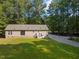 Aerial view of a house and detached garage with spacious yard at 126 Yuma Dr, Louisburg, NC 27549