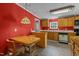 Kitchen features wood cabinets, tiled floor and stainless steel appliances at 126 Yuma Dr, Louisburg, NC 27549