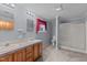 Main bathroom with double vanity, shower, and toilet at 126 Yuma Dr, Louisburg, NC 27549