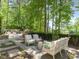 Landscaped backyard with seating area and tranquil views at 50211 Manly, Chapel Hill, NC 27517
