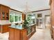 Bright kitchen with island, double ovens, and views to backyard at 50211 Manly, Chapel Hill, NC 27517