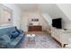 Cozy sitting area with a comfortable sofa, TV, and wet bar at 50211 Manly, Chapel Hill, NC 27517