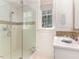 Bathroom with shower, vanity, and window at 50211 Manly, Chapel Hill, NC 27517