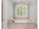 Spa-like bathroom with a soaking tub and decorative wallpaper at 50211 Manly, Chapel Hill, NC 27517