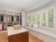 Spacious walk-in closet with window seat and built-in shelving at 50211 Manly, Chapel Hill, NC 27517