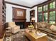 Warm and inviting library with wood paneling, fireplace and comfortable seating at 50211 Manly, Chapel Hill, NC 27517