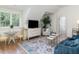 Charming sitting area with a comfortable sofa, TV, and a small table at 50211 Manly, Chapel Hill, NC 27517