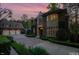 Grand stone house with a three-car garage and manicured landscaping at 50211 Manly, Chapel Hill, NC 27517