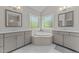 Spa-like bathroom with corner soaking tub and double vanities at 2517 Snyder Ln, Wake Forest, NC 27587