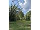 Wooded lot with a grassy clearing and large trees at 4285 Belltown Rd, Oxford, NC 27565