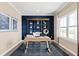 Home office with built-in shelving and a view of the backyard at 521 Impala Trce, Wendell, NC 27591