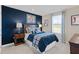 Charming bedroom with navy blue walls and baseball-themed decor at 521 Impala Trce, Wendell, NC 27591