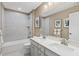 Modern bathroom with double vanity, shower, and bathtub at 521 Impala Trce, Wendell, NC 27591