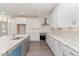 Modern kitchen with white cabinets and marble countertops at 600 Darian Woods Drive,, Holly Springs, NC 27540