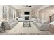 Spacious living room featuring a stone fireplace and built-in shelving at 600 Darian Woods Drive,, Holly Springs, NC 27540