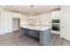 Modern kitchen with white cabinets and large kitchen island at 600 Darian Woods Drive,, Holly Springs, NC 27540