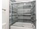 Clean bathroom with a shower/tub combo and gray tile at 600 Darian Woods Drive,, Holly Springs, NC 27540