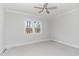 Charming bedroom with a large window and ceiling fan at 600 Darian Woods Drive,, Holly Springs, NC 27540