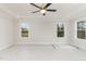 Spacious bedroom with plush carpet and large windows offering natural light at 600 Darian Woods Drive,, Holly Springs, NC 27540